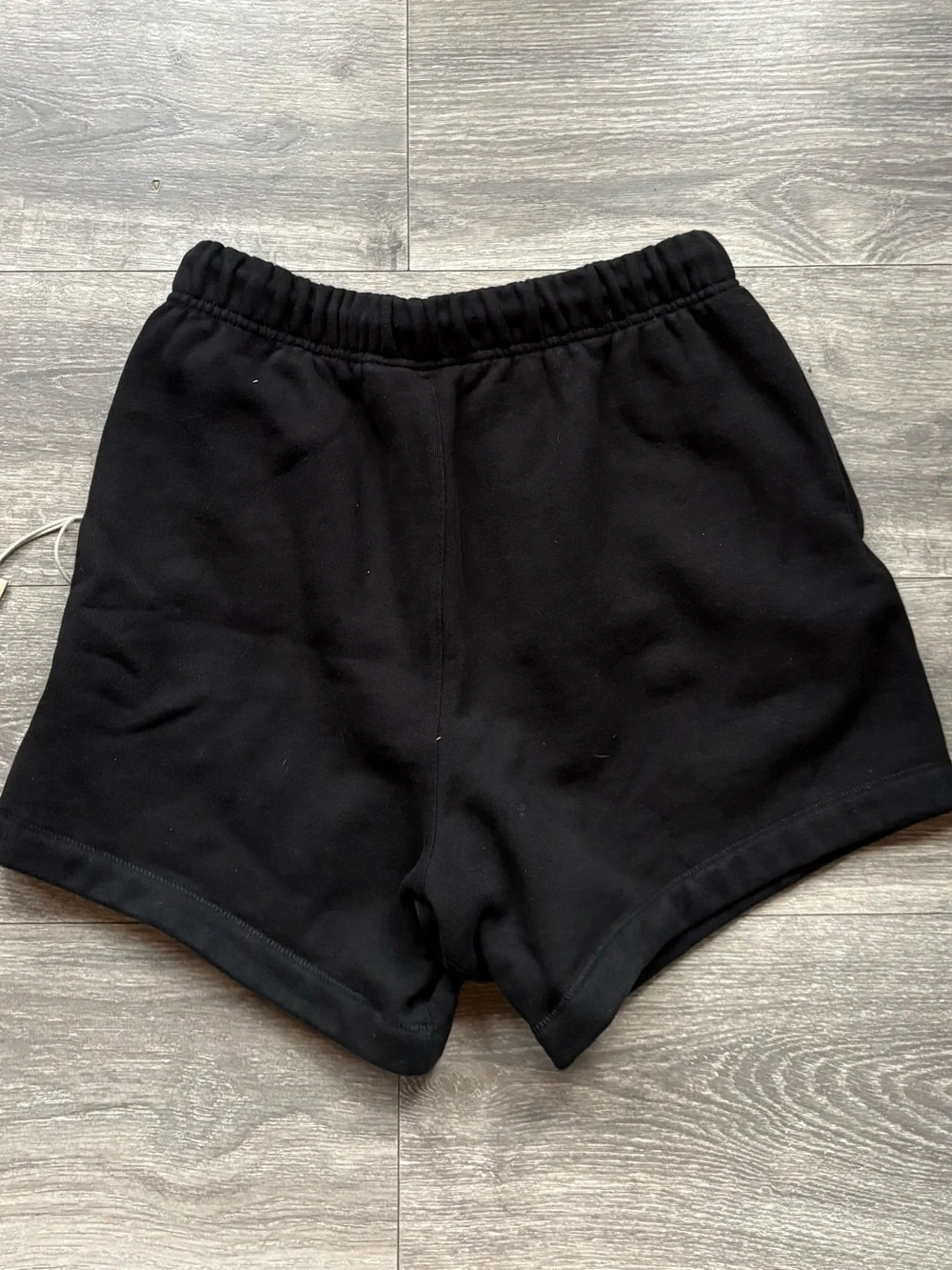 Fear of God ESSENTIALS Black Tee with Cream Hang Tag